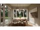 Bright dining room features a round table with modern pendant lighting and sliding doors to the outdoors at 725 Catawba St, Raleigh, NC 27609