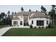 Stunning two-story home featuring a modern design with a brick and siding facade and lush landscaping at 725 Catawba St, Raleigh, NC 27609