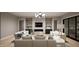 Contemporary living room showcasing a fireplace, built-in shelving, modern lighting, and comfortable seating at 725 Catawba St, Raleigh, NC 27609