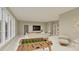 Spacious living room with a foosball table, comfy seating, and a TV, great for entertainment at 725 Catawba St, Raleigh, NC 27609