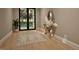 Bright living room featuring natural light, wood floors, decorative rug, and stylish console table at 725 Catawba St, Raleigh, NC 27609