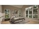 Serene primary bedroom with large windows offering scenic views, stylish furnishings, and minimalist decor at 725 Catawba St, Raleigh, NC 27609