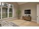 Bright and airy bedroom with a view and a TV, featuring hardwood floors and ample natural light at 725 Catawba St, Raleigh, NC 27609