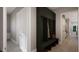 Mudroom with built-in bench seating and storage cabinets that lead to a spacious kitchen area at 725 Catawba St, Raleigh, NC 27609