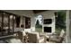Inviting outdoor patio with comfortable seating, a fireplace, and views of the landscaped yard at 725 Catawba St, Raleigh, NC 27609