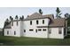 Exterior of the home showcasing the architectural style and large windows allowing for lots of natural light at 725 Catawba St, Raleigh, NC 27609