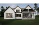 Beautiful backyard featuring a covered patio with an outdoor fireplace, perfect for entertaining at 725 Catawba St, Raleigh, NC 27609