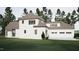 Exterior of home featuring a three-car garage, well-maintained lawn, and classic design at 725 Catawba St, Raleigh, NC 27609