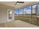 Screened back porch overlooking a green lawn, ceiling fan and views of nearby house at 73 Jumper St, Wendell, NC 27591
