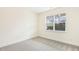 Spacious bedroom with neutral carpeting and large window at 73 Jumper St, Wendell, NC 27591