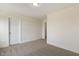A bedroom with carpet flooring, white walls, and a five-panel door at 73 Jumper St, Wendell, NC 27591