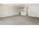 A bonus room with carpet flooring, white walls, and natural light at 73 Jumper St, Wendell, NC 27591