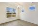 Dining room features hardwood floors, neutral paint, large windows and modern lighting fixture at 73 Jumper St, Wendell, NC 27591