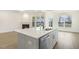 Kitchen island with quartz countertop and sink at 73 Jumper St, Wendell, NC 27591