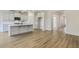 Modern kitchen featuring white cabinetry, stainless steel appliances, and a center island at 73 Jumper St, Wendell, NC 27591