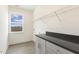 Laundry room with built in cabinets and shelving at 73 Jumper St, Wendell, NC 27591