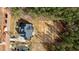 Bird's eye view of a new home on a vast lot, backing up to a lush green forest at 30 Chestnut Oak Dr, Youngsville, NC 27596