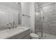 Bathroom featuring a single vanity with countertop and tiled shower at 30 Chestnut Oak Dr, Youngsville, NC 27596