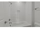 Bright bathroom showcasing a white tiled shower and modern fixtures at 30 Chestnut Oak Dr, Youngsville, NC 27596
