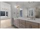 Spacious bathroom with double vanity, large mirror and view to a brightly-lit room with a view at 30 Chestnut Oak Dr, Youngsville, NC 27596