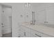 Bathroom featuring a single vanity with countertop and tiled tub at 30 Chestnut Oak Dr, Youngsville, NC 27596