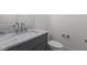 Bathroom featuring a single vanity with countertop and tiled shower at 30 Chestnut Oak Dr, Youngsville, NC 27596