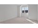 Bedroom featuring carpet floors and a large window at 30 Chestnut Oak Dr, Youngsville, NC 27596