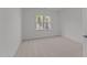 Bedroom featuring carpet floors and large windows at 30 Chestnut Oak Dr, Youngsville, NC 27596
