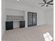 Bonus room featuring carpet floors, ceiling fan, wet bar, and french doors at 30 Chestnut Oak Dr, Youngsville, NC 27596