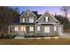 Charming two-story home with a welcoming front porch, complemented by a meticulously landscaped yard at 30 Chestnut Oak Dr, Youngsville, NC 27596