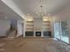 Gathering room with stone fireplace and built-in shelving at 30 Chestnut Oak Dr, Youngsville, NC 27596