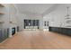 Open floor plan with fireplace, kitchen, and screened in porch at 30 Chestnut Oak Dr, Youngsville, NC 27596