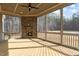 Inviting sunroom with a brick fireplace and expansive views at 30 Chestnut Oak Dr, Youngsville, NC 27596