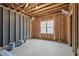 Unfinished room framed and ready, featuring a large window at 30 Chestnut Oak Dr, Youngsville, NC 27596