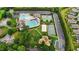 Aerial view of the community pool, tennis courts, and playground at 4110 Argyle Trl, Burlington, NC 27215