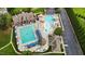 Stunning aerial view of the community pool and clubhouse with resort-style amenities and landscaping at 4110 Argyle Trl, Burlington, NC 27215