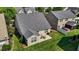 Aerial view of a well-maintained backyard with an outdoor patio and mature landscaping at 4110 Argyle Trl, Burlington, NC 27215