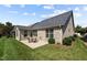 Cozy backyard featuring a brick exterior, neat landscaping, and an inviting outdoor patio set at 4110 Argyle Trl, Burlington, NC 27215