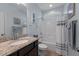 Bathroom with granite counter tops, framed mirror, and a shower/tub combo at 4110 Argyle Trl, Burlington, NC 27215