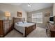Bedroom with a large window and wood furniture at 4110 Argyle Trl, Burlington, NC 27215