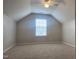 Upstairs bonus room with neutral walls, plush carpet, and great natural light at 4110 Argyle Trl, Burlington, NC 27215