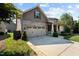 Delightful exterior view featuring an attached two-car garage and a cozy front porch at 4110 Argyle Trl, Burlington, NC 27215