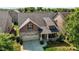 Charming home showcasing a covered porch, neat landscaping, and a two-car garage, enhancing its curb appeal at 4110 Argyle Trl, Burlington, NC 27215