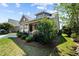 Beautiful home with a lush lawn, picturesque front porch, and a convenient attached two-car garage at 4110 Argyle Trl, Burlington, NC 27215