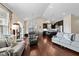 Spacious living room with hardwood floors, seating, and an open flow to the kitchen at 4110 Argyle Trl, Burlington, NC 27215