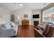 Spacious living room featuring hardwood floors, natural light, and a fireplace at 4110 Argyle Trl, Burlington, NC 27215