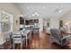Open-concept floorplan features hardwood floors and a modern kitchen with a breakfast bar at 4110 Argyle Trl, Burlington, NC 27215