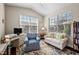 Cozy room features hardwood floors, bright light, and a ceiling fan at 4110 Argyle Trl, Burlington, NC 27215
