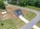 Aerial view of a two story home with a long driveway at 22 Van Winkle St, Lillington, NC 27546
