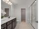 Modern bathroom with a double vanity and glass shower at 22 Van Winkle St, Lillington, NC 27546